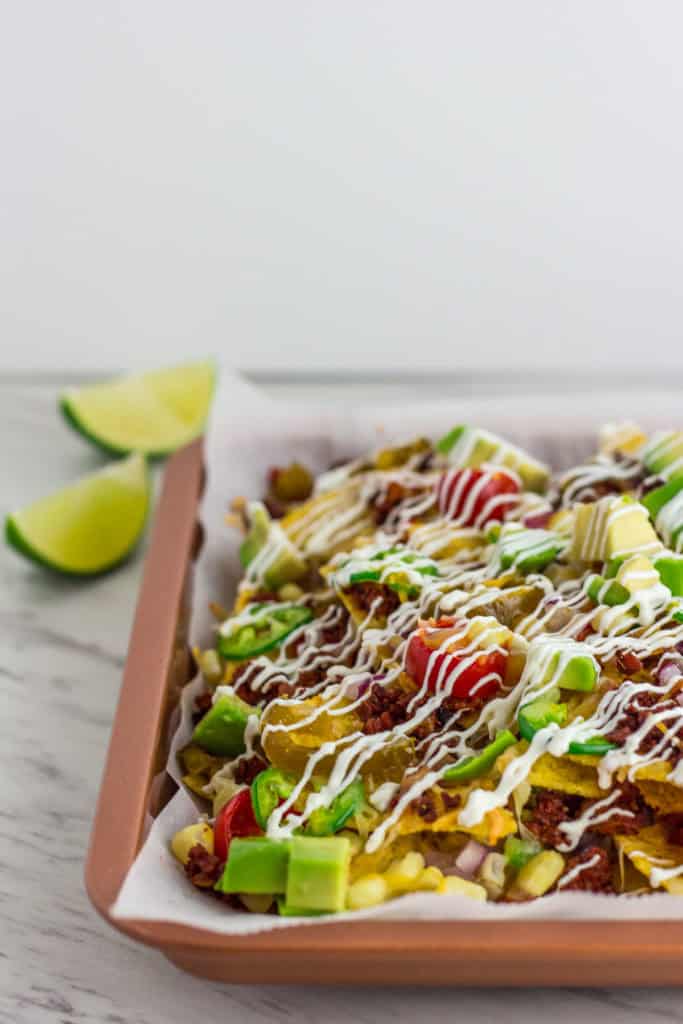 Nachos with soy chorizo, after sour cream, close up