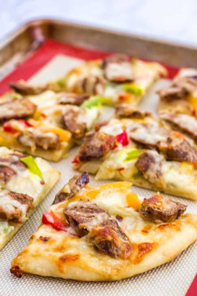 picture of vegan sausage pepper and onion pizza
