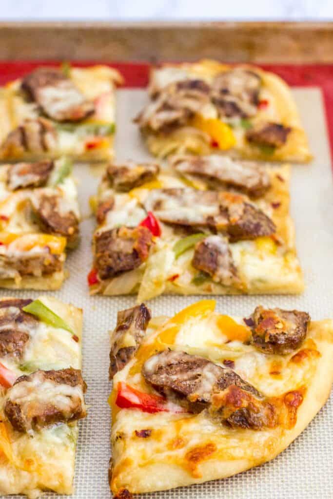 picture of vegan sausage pepper and onion pizza
