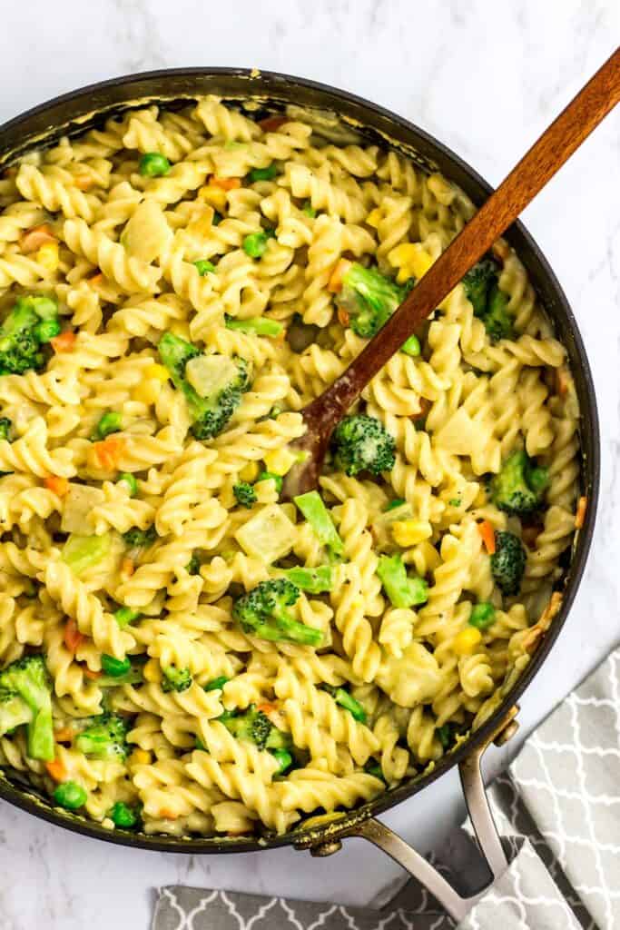 overhead shot of skillet full of no dairy white sauce veggie pasta