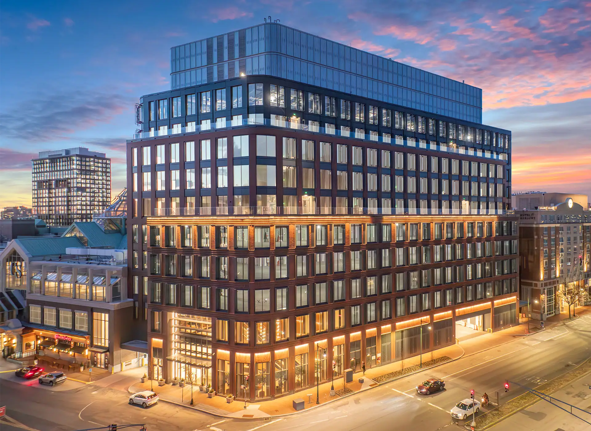 Modern multi-story office building at sunset in CambridgeSide area.