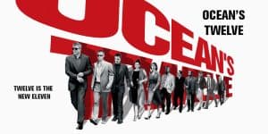 Promotional poster for Ocean's Twelve featuring the main cast in stylish suits.