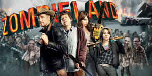 Group of four characters from Zombie Land with zombies in the background, discussing the film.