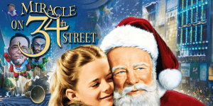 Festive scene with Santa Claus and a girl in Times Square during Christmas.