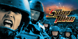 Intense scene from Starship Troopers featuring soldiers in combat gear.
