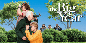 Group of birdwatchers observing birds in a park during The Big Year event.