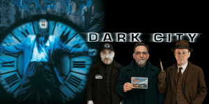 Three men from the Dark City movie review podcast standing in front of a clock background.