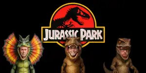 Three hosts dressed as dinosaurs for Jurassic Park movie review podcast.