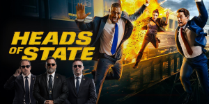 Action scene from "Heads of State" featuring men in suits and explosions in the background.