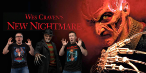 Three hosts discuss Wes Craven's horror film "New Nightmare" with a Freddy Krueger image in the back.