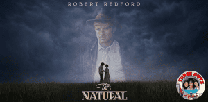 Movie poster for "The Natural" featuring Robert Redford with a dark, moody background.