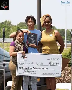 Student Isaiah Bryars Receiving Scholarship check