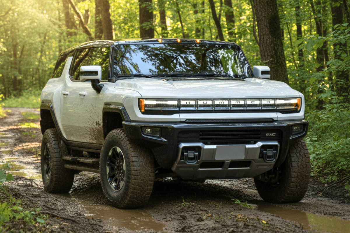 2025 GMC Hummer EV SUV Offroading in forest