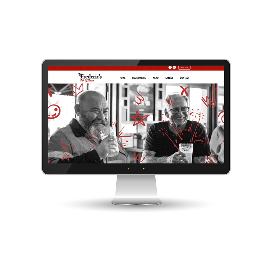 Frederic's Cafe website homepage with two smiling men enjoying drinks.