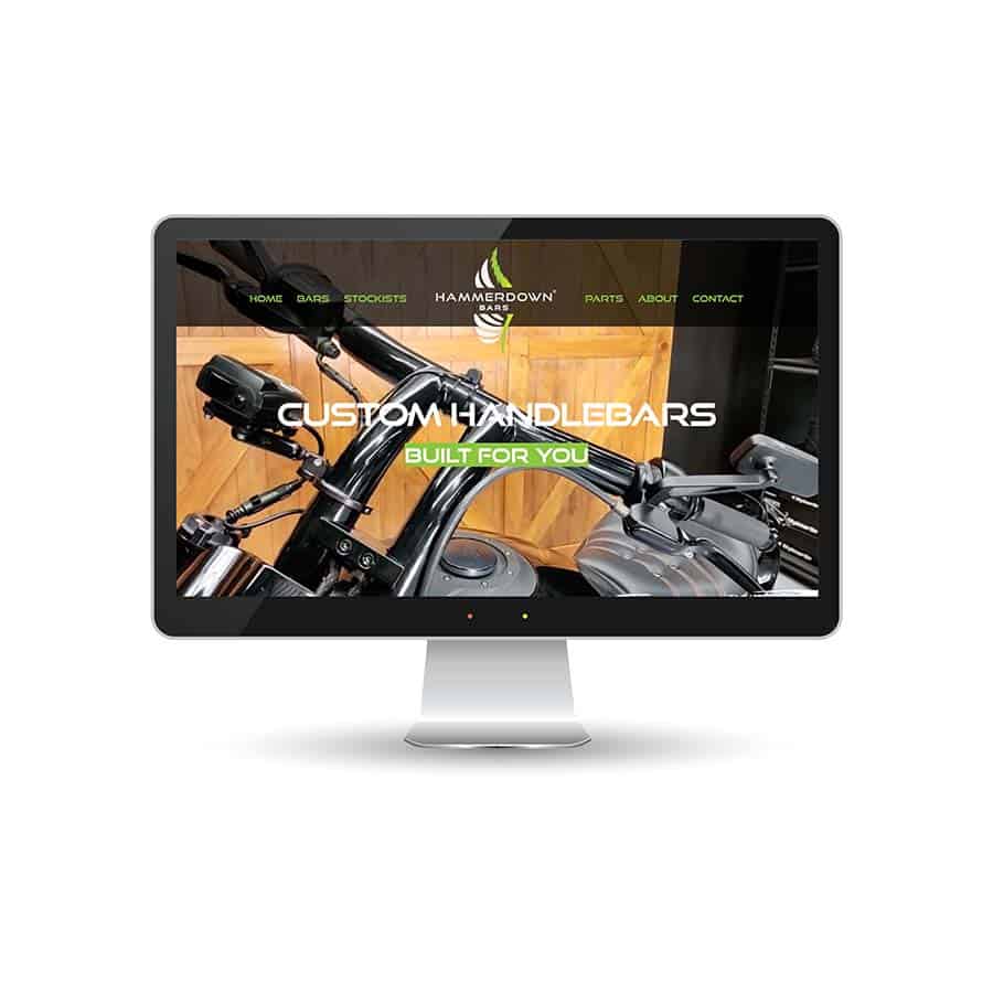 Hammerdown Bars website Custom motorcycle handlebar display on a sleek computer monitor, showcasing handcrafted bike parts.