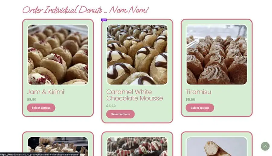 English (NZ) - Close-up of assorted NZ donuts with toppings and fillings.