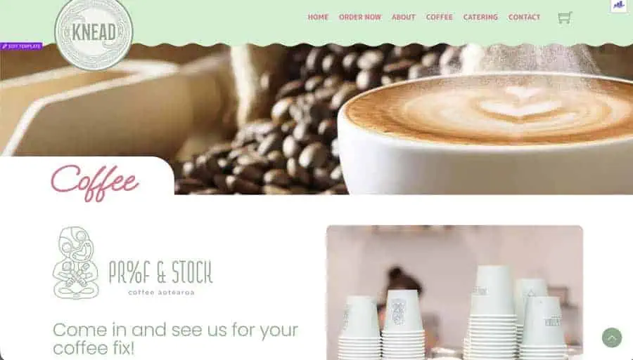 High-quality coffee beans and a frothy latte in a cozy café setting.