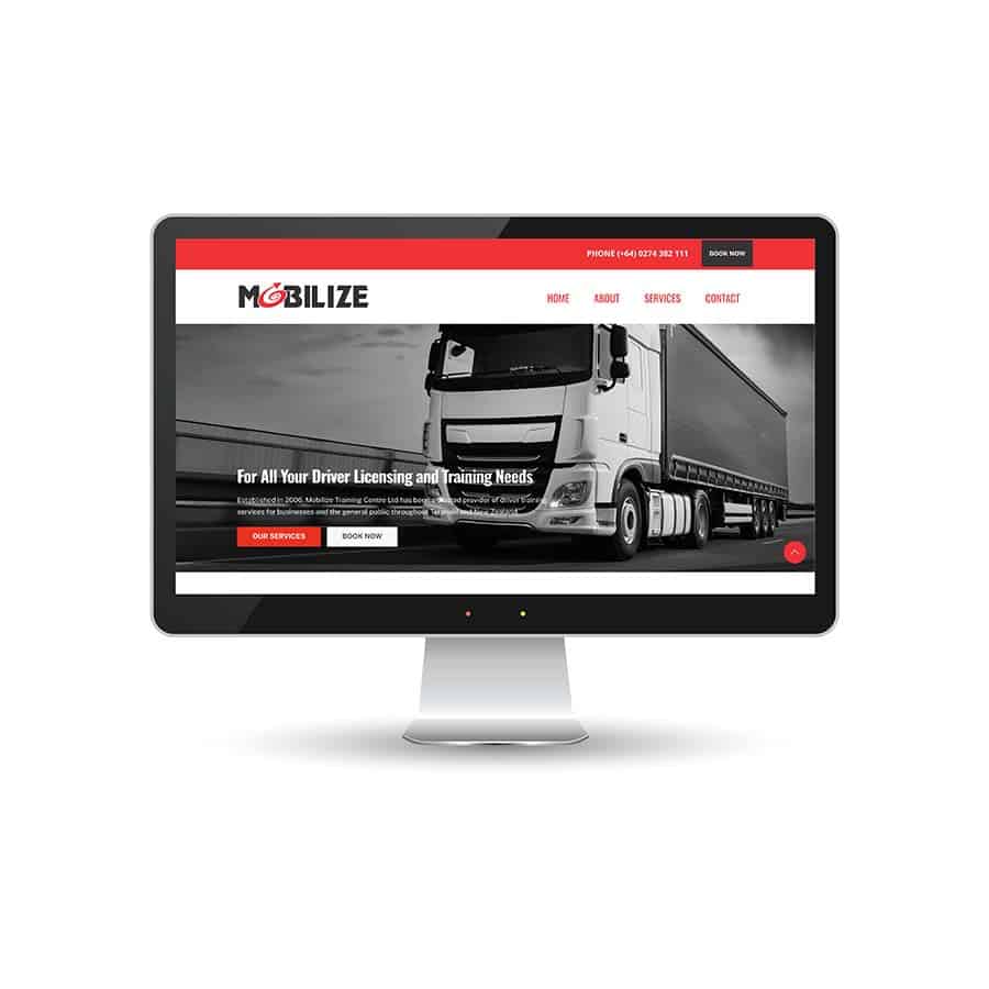 Mobilize Heavy vehicle driver training website displayed on monitor, promoting licensing and training services in New Zealand.