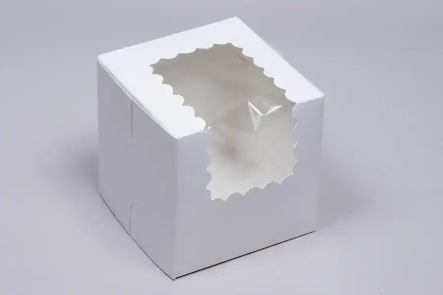 Empty white packaging box with a transparent window for product display.