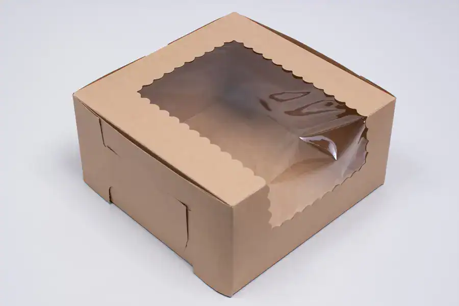 Eco-friendly kraft cupcake box with clear window for display.
