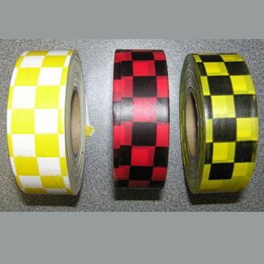 Flagging tape with blue and black checkered pattern for marking and safety applications.