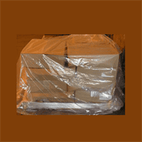 Stacked cardboard boxes wrapped in plastic for shipping and storage.