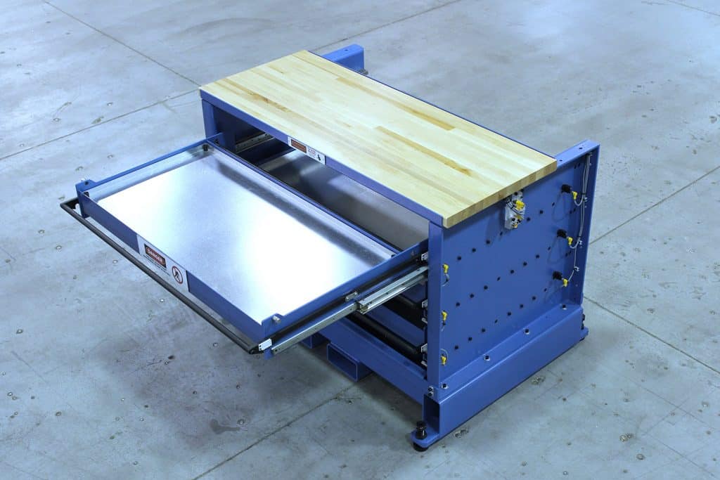 Industrial workbench with wooden surface and adjustable height features.