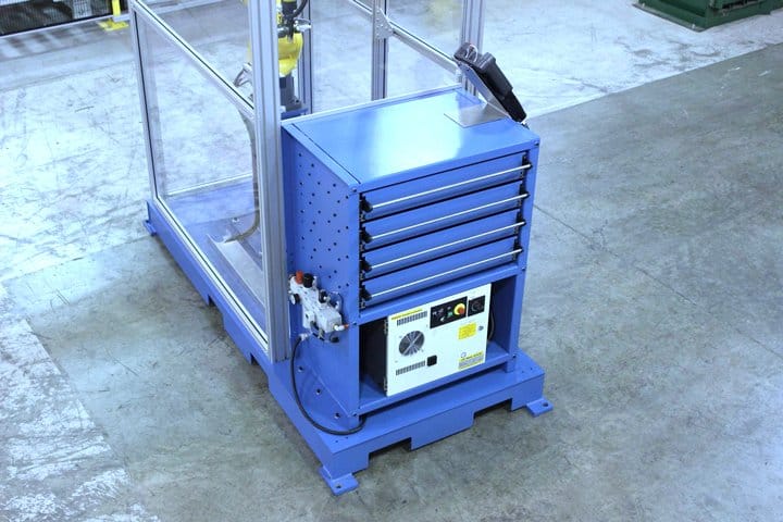 Mobile storage cart with drawers and control panel for industrial use.