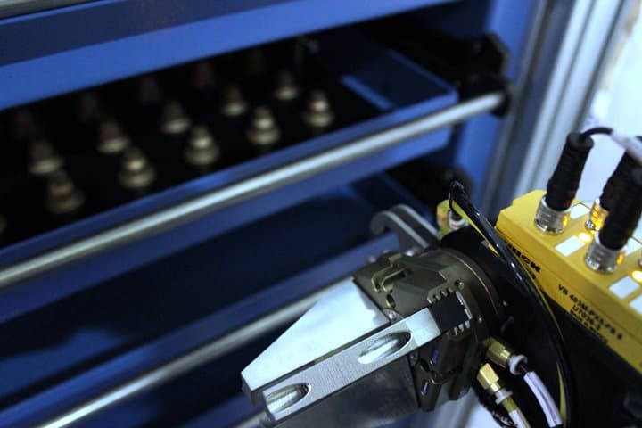 Close-up of industrial machinery and control panel at Adaptec Solutions.