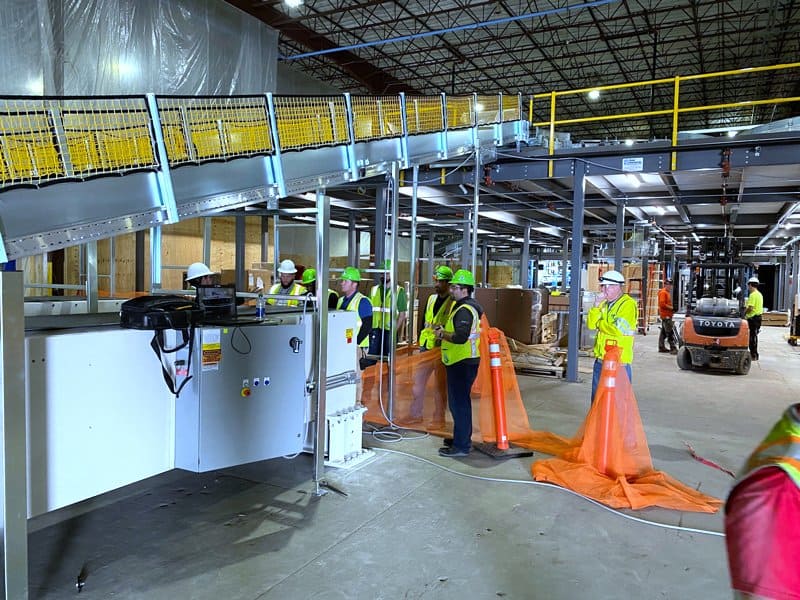 Adaptec installs SRS Santa Rosa Systems Telescopic Conveyors and controls at Global Retailer