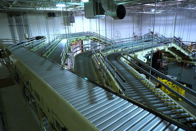 Hytrol Shoe Sortation Conveyor feeding multiple Hytrol CDLR conveyor lines