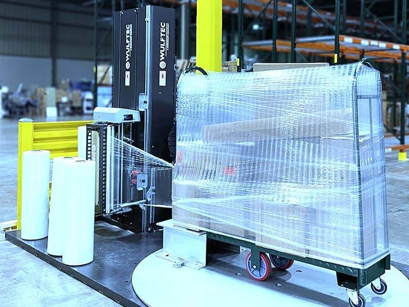 Automated pallet wrapping machine at medical warehouse expansion.