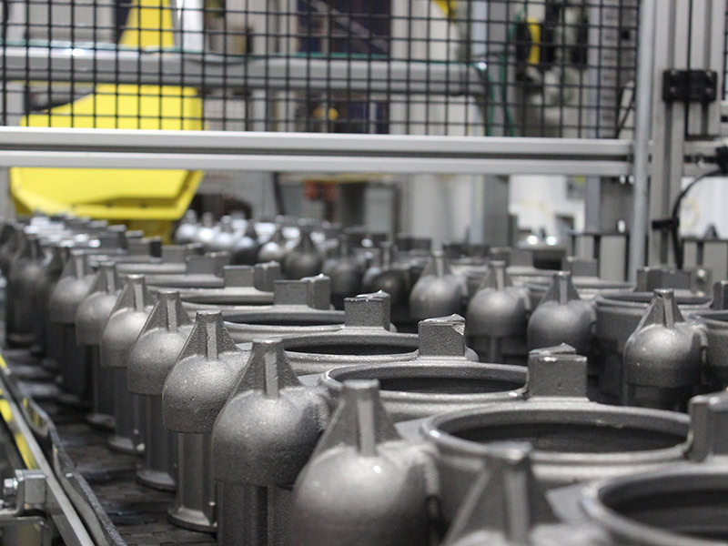 Robotic arms automate pump component assembly at Adaptec Solutions.
