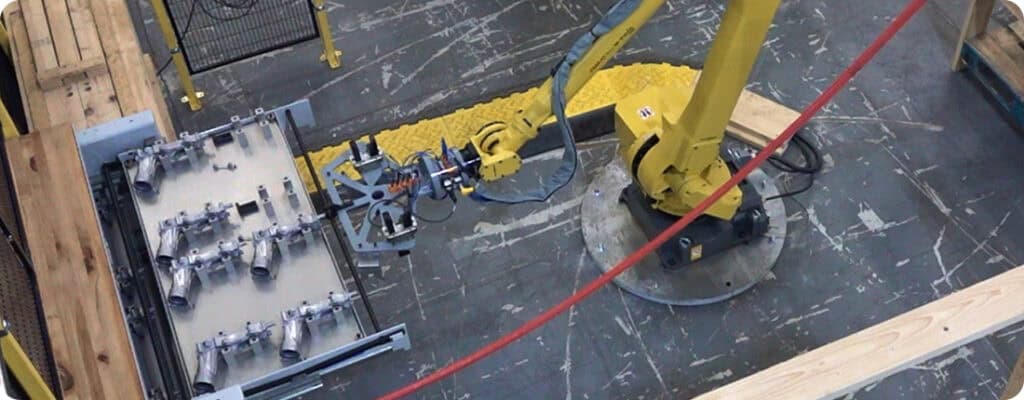 drawer system being opened by FANUC robot at Adaptec Solutions