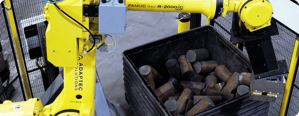 robotic bin picker picking up metal billets in the forging industry