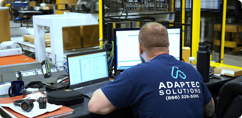 engineer sitting at computer at Adaptec Solutions