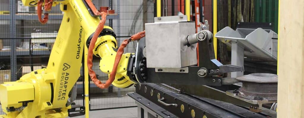 Yellow industrial robot with end of arm tool