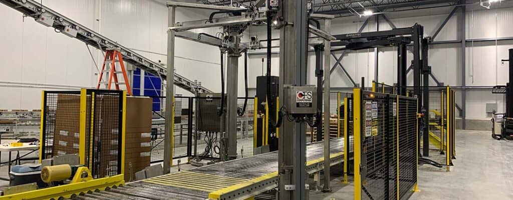 Industrial manufacturing equipment at Adaptec Solutions facility.