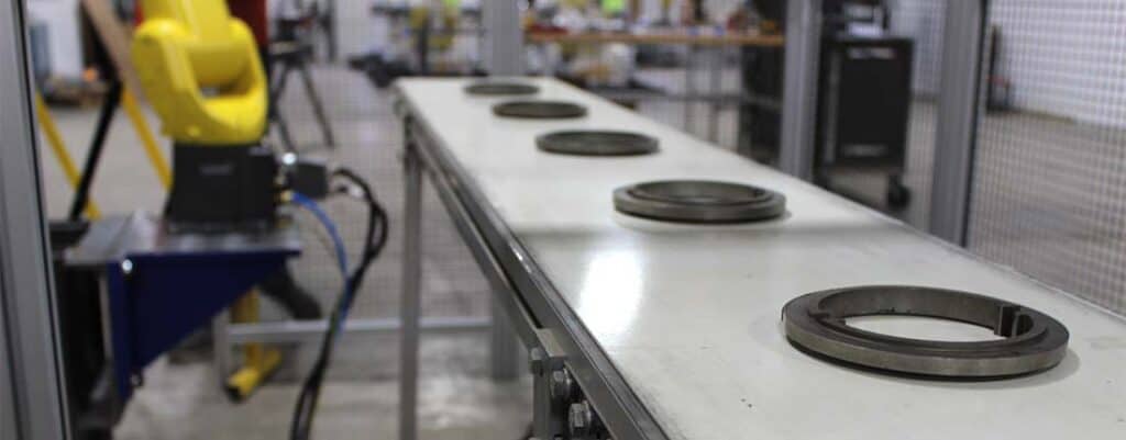 metal parts in a robotic automation system in manufacturing