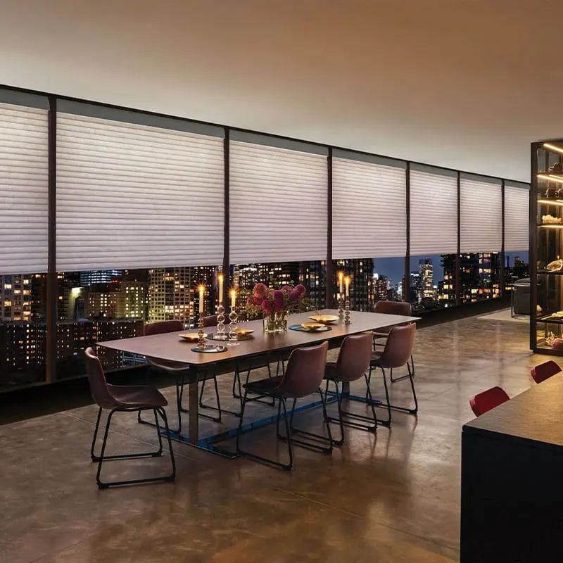 Custom window blinds for a modern high-rise dining room, offering privacy and style in an urban setting. Perfect for city apartments and commercial spaces seeking elegant window treatment solutions.
