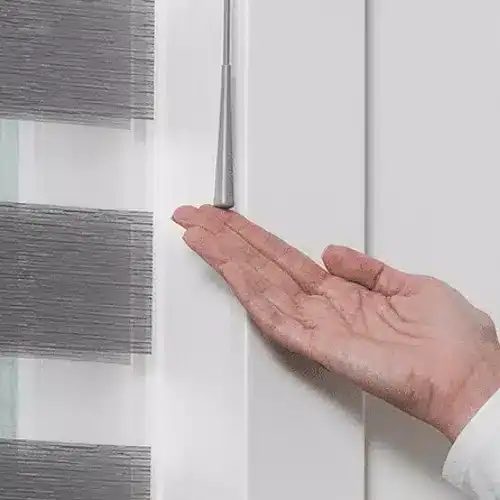 Smooth white window blinds being installed, showcasing professional window treatment services from Advance Blinds & Drapery.