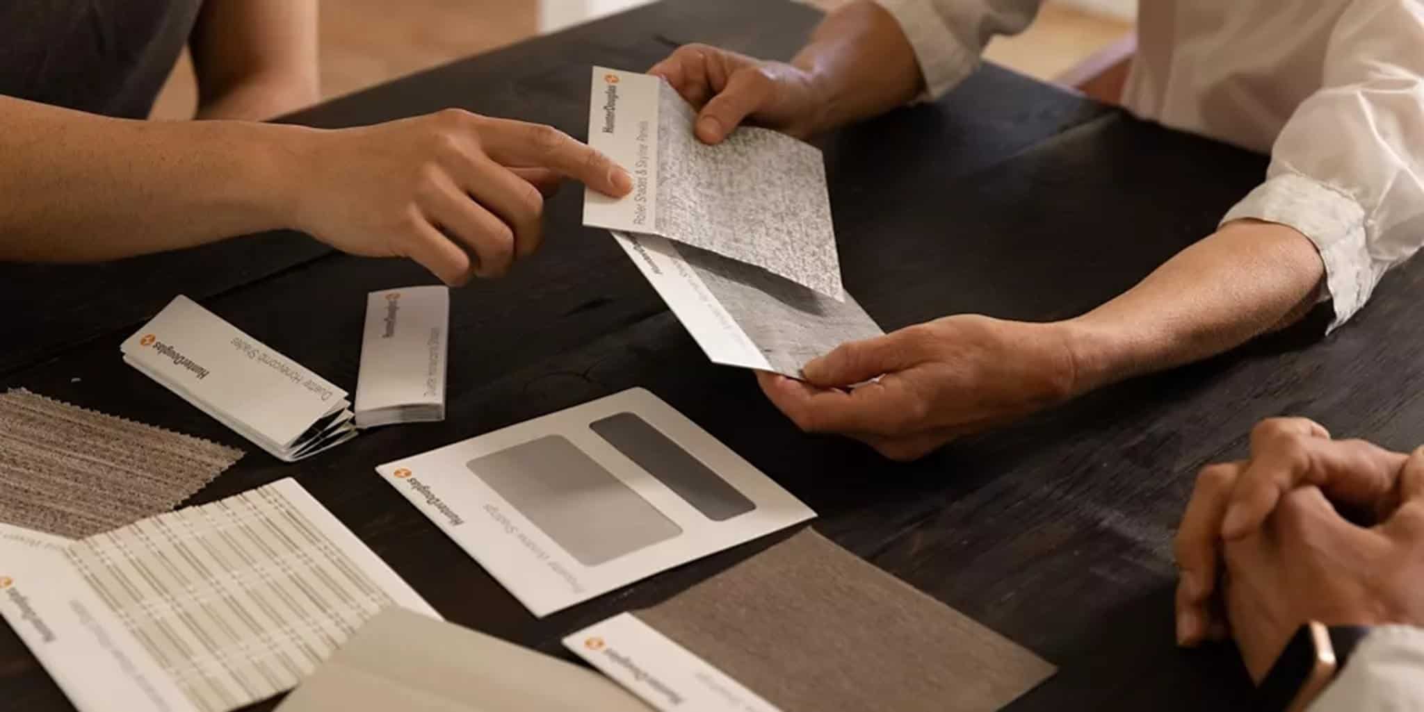 Bright and inviting interior showcasing custom window treatments with fabric samples for blinds and drapery. Perfect for enhancing home decor with expert consultation from Advance Blinds & Drapery.