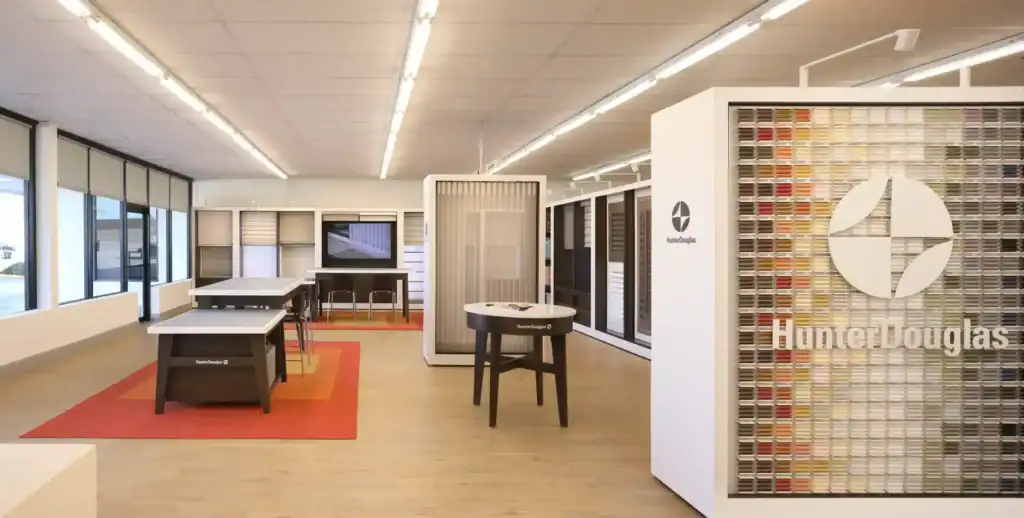 Elegant window blinds display at Advance Blinds & Drapery showroom with Hunter Douglas shades and custom window treatments.