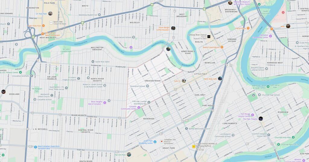 Map of downtown riverfront area with streets, parks, and bridges.