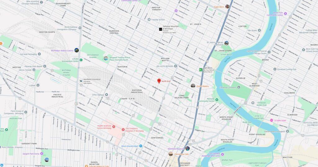 Map of downtown area showing streets, river, parks, and landmarks in a city.