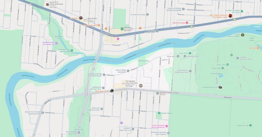 Map showing a river flowing through a city with parks, walking paths, and various landmarks along the riverbanks.