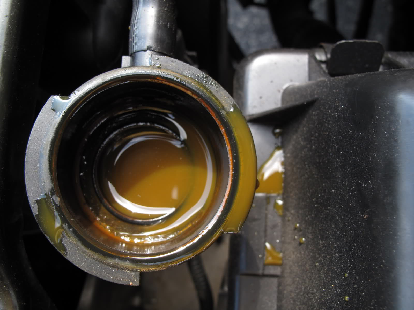 Mechanic flushing coolant system on a car