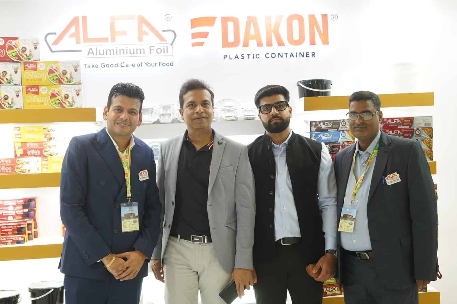 Alfa Foil Containers and DAKON plastic containers displayed at a trade exhibition.