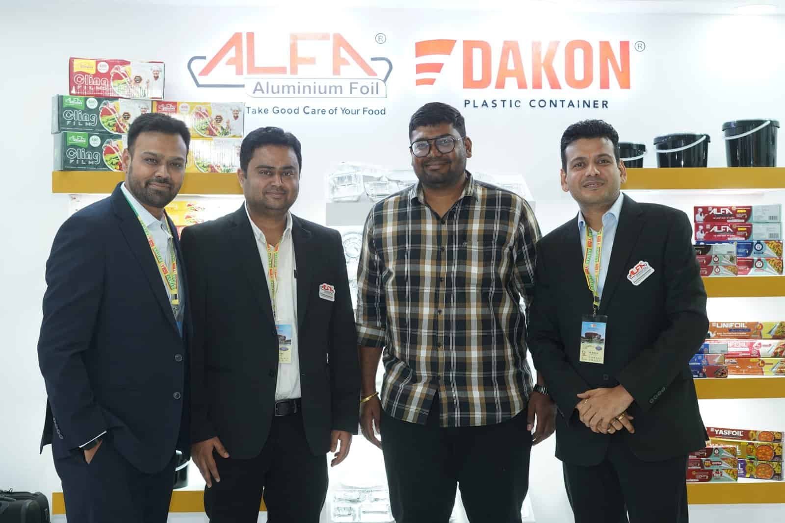 Alfa Foil Containers display with team at trade event for food packaging solutions.