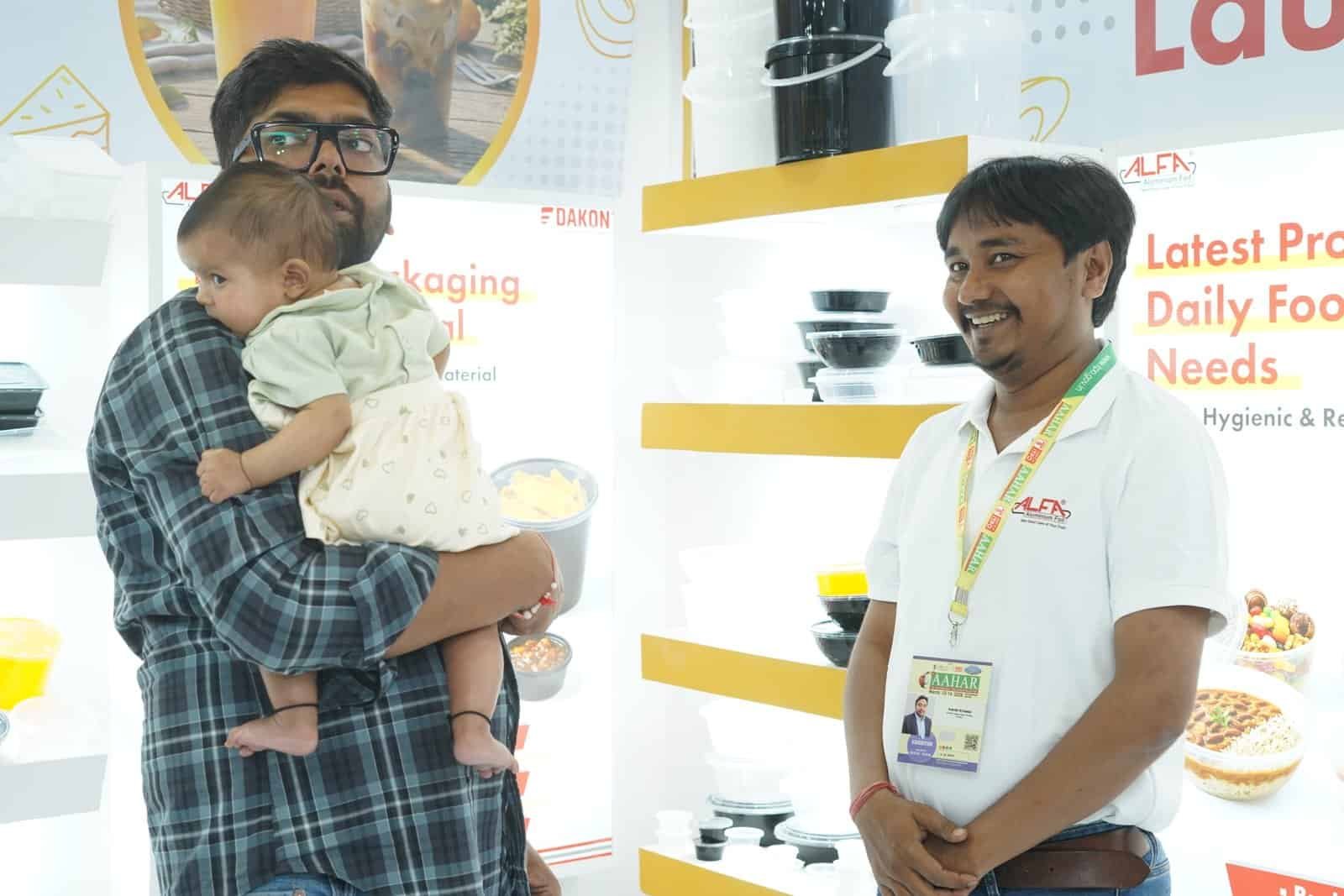 Alfa Foil Containers showcased at a trade event for food packaging solutions.